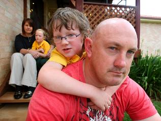 Chris and Catherine Sutton with their children Charlie, 5, and Lily, 8, at their home in Orange, NSW. Picture: Nathan Edwards