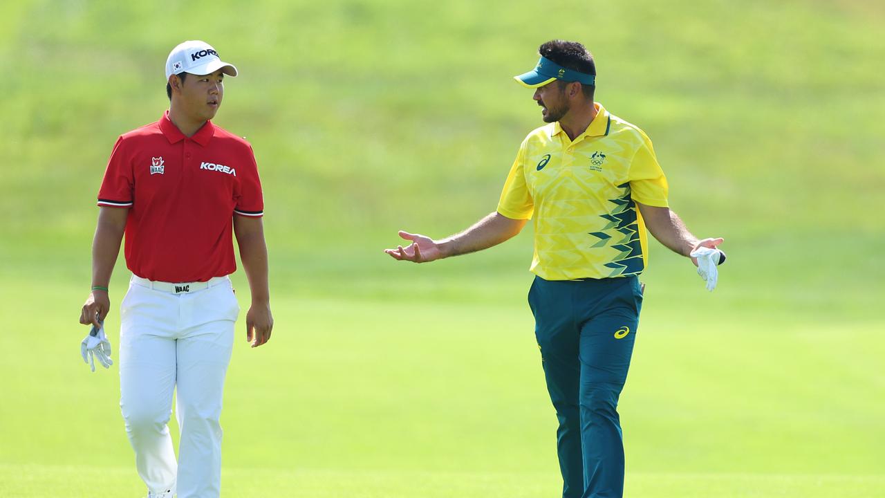 PARIS, FRANCE - AUGUST 01: Tom Kim of Team Democratic PeopleÃ¢â&#130;¬â&#132;¢s Republic of Korea and Jason Day of Team Australia interact on the fifth hole during Day One of the Men's Individual Stroke Play on day six of the Olympic Games Paris 2024 at Le Golf National on August 01, 2024 in Paris, France. (Photo by Andrew Redington/Getty Images)