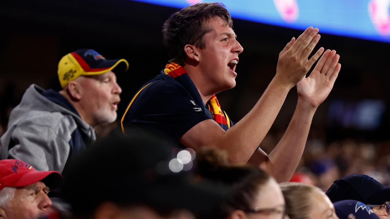 Crows fans cheer on their team earlier this month against Melbourne – one of the clubs with a better winning record at Adelaide Oval. Picture: Michael Willson/AFL Photos via Getty Images