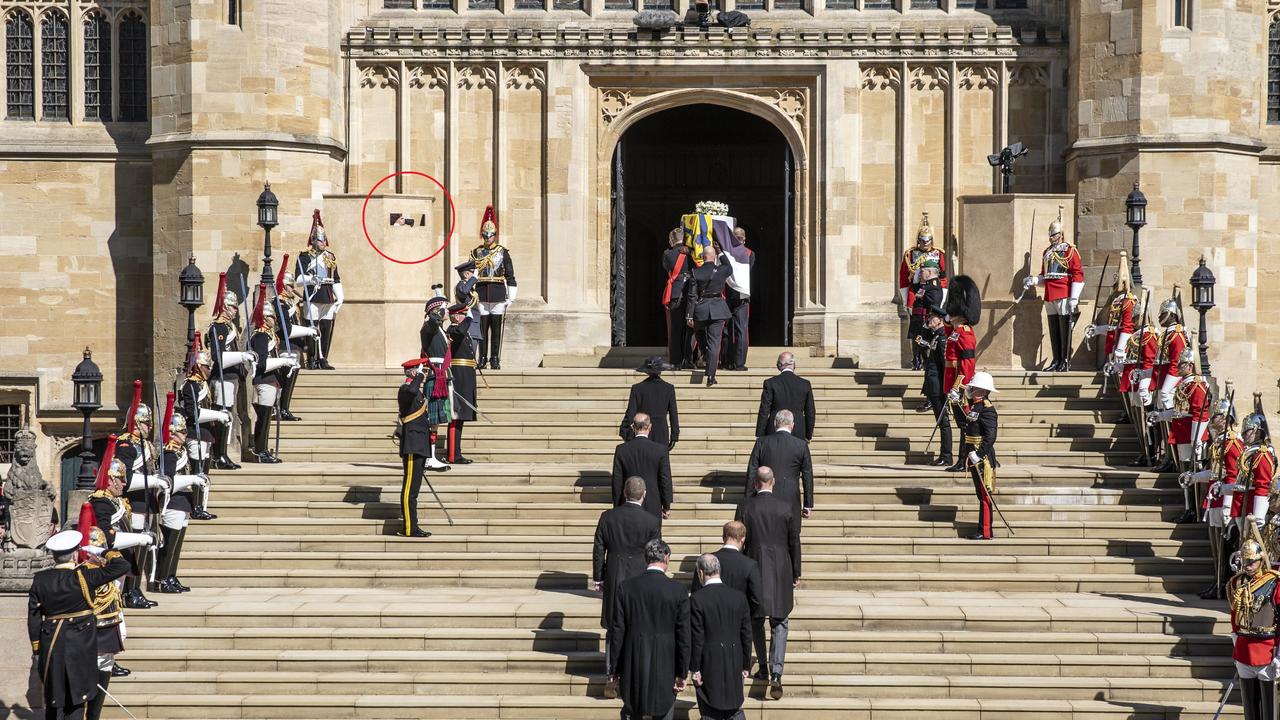 Photographer Arthur Edwards hides inside a pillar at the funeral (circled in red). Picture: WPA Pool/Getty Images