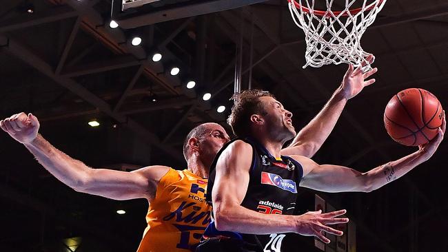 Nathan Sobey powers to the basket against the Sydney Kings’ Aleks Maric. Picture: Daniel Kalisz (Getty Images)