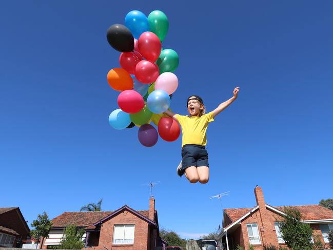 Louis, 7, gets into the spirit for UP at Cinema in the Park in Anderson Park, Hawthorn. Picture: Alex Coppel