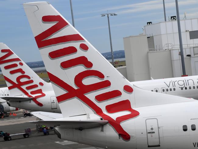 SYDNEY, AUSTRALIA - NCA NewsWire Photos DECEMBER, 18, 2020: A Virgin Australia aircraft at the Domestic terminal at Sydney Airport in Sydney. Picture: NCA NewsWire/Joel Carrett