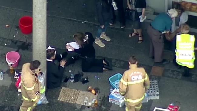 Victims outside the bank where Nur Islam sparked a fire. Picture: Seven News