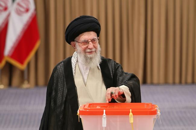 Iran's supreme leader Ayatollah Ali Khamenei, who wields ultimate authority, casts his ballot during the runoff
