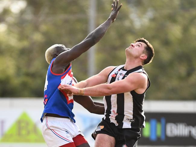 Anthony Daw and Stefan Uzelac fly high in the ruck. Picture: Nathan McNeill