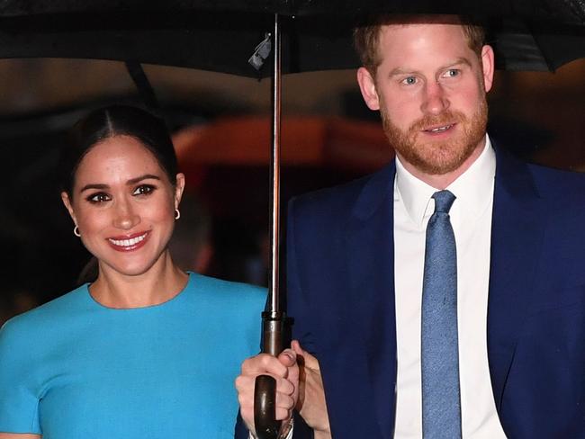 (FILES) In this file photo taken on March 5, 2020 Britain's Prince Harry, Duke of Sussex (R) and Meghan, Duchess of Sussex arrive to attend the Endeavour Fund Awards at Mansion House in London. - Prince Harry and Meghan Markle filed a lawsuit July 23 in Los Angeles against one or more paparazzi whom they accuse of taking pictures of their son without permission, their lawyer told AFP. (Photo by DANIEL LEAL-OLIVAS / AFP)