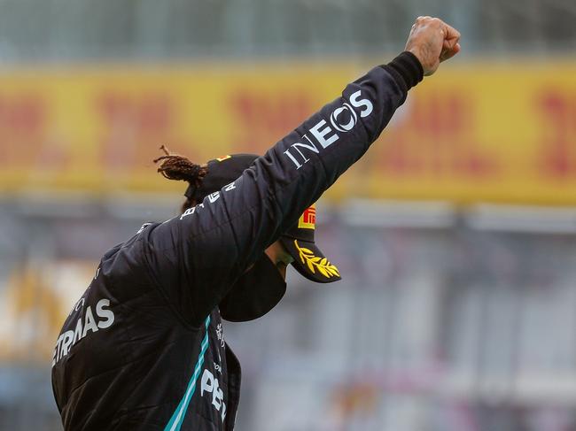 Formula One driver Lewis Hamilton raises a fist on the podium in a Black Live Matter protest. Picture: AFP