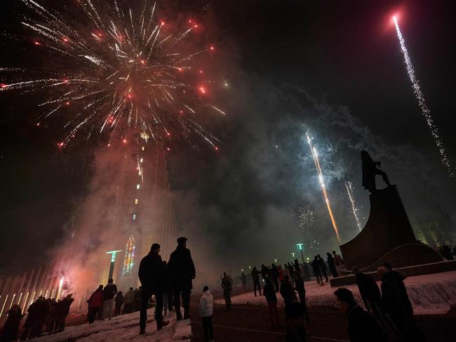 Icelandic people celebrate New Year's Eve and hope for a brighter 2021 as fireworks light up the sky in Reykjavik, Iceland. Picture: AFP