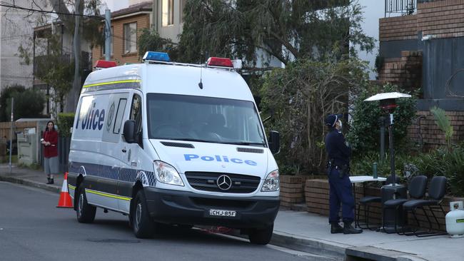 Police guard the apartment block in Botany St, Bondi Junction. Picture: John Grainger