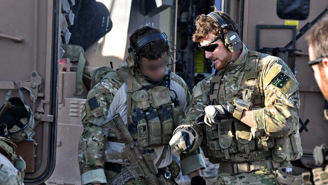 Mr Roberts-Smith and his SAS colleagues shortly before the Battle of Tizak in 2010 that saw him awarded the Victoria Cross for bravery.