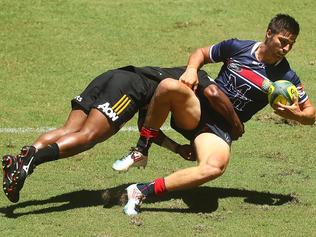 BRISBANE, AUSTRALIA - FEBRUARY 11: Jack Maddocks of the Rebels is tackled by Tauke'iaho of the Chiefs during the Rugby Global Tens match between Rebels and Chiefs at Suncorp Stadium on February 11, 2017 in Brisbane, Australia. (Photo by Chris Hyde/Getty Images)