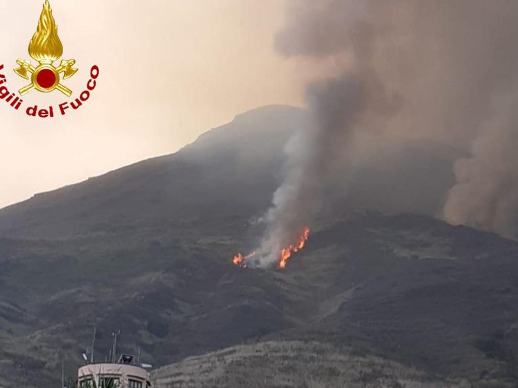 The strong volcanic explosion sent flaming lava rolling down the volcano’s slopes to the edge of the sea. Picture: Vigili del Fuoco/AFP