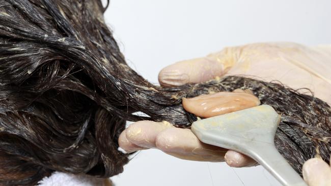 White and African-American women who regularly dye their hair dark brown or black, or chemically straighten their hair, have a higher risk of breast cancer, new research has found.