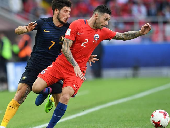 Australian forward Mathew Leckie (left) vies with Chile defender Eugenio Mena during their Confederations Cup clash this year.