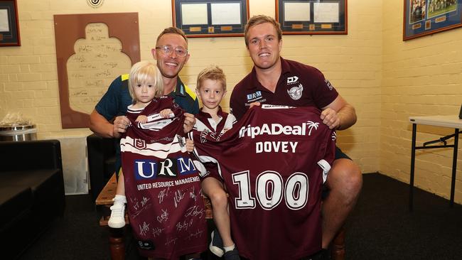 Australian cricket team manager Gavin Dovey with children Remi (2) and Koda (4) after being presented a Manly jersey by Jake Trbojevic. Picture: Brett Costello