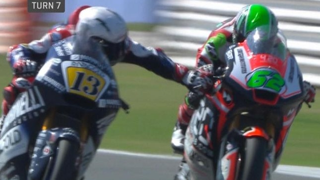 Romano Fenati grabs the brake lever of rival Stefano Manzi mid-race.