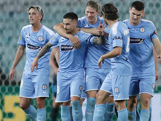 SYDNEY, AUSTRALIA - AUGUST 01: Jamie Maclaren of Melbourne City celebrates scoring a goal with team mates during the round 29 A-League match between Melbourne City and Sydney FC at ANZ Stadium on August 01, 2020 in Sydney, Australia. (Photo by Mark Metcalfe/Getty Images)