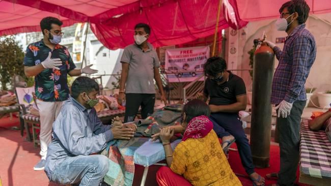 Covid-19 patients receive free oxygen, supplied by Khalsa Help International, at the Shri Guru Singh Sabha Gurudwara in Uttar Pradesh. Picture: Sumit Dayal/Bloomberg