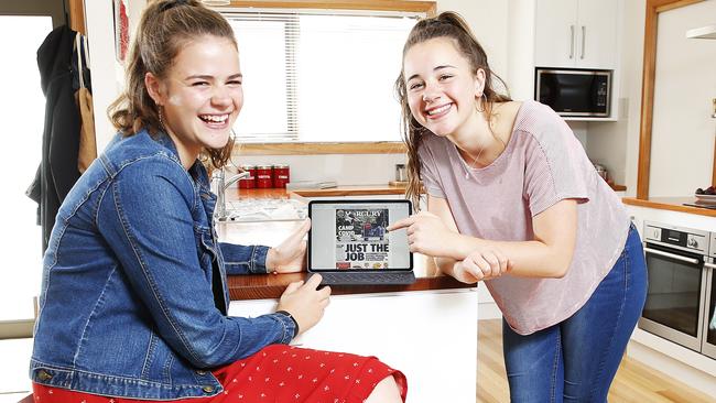 Sisters Molly and Tilly Hartog check out the digital edition of the Mercury. Picture: Zak Simmonds