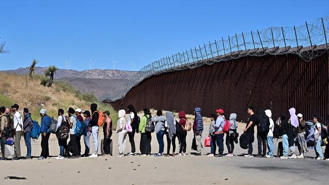 Migrants wait in line hoping for processing from Customs and Border Patrol agents after groups arrived at Jacumba Hot Springs, California, after walking under intense heat from Mexico into the US on June 5, 2024. Picture: Frederic J. Brown / AFP