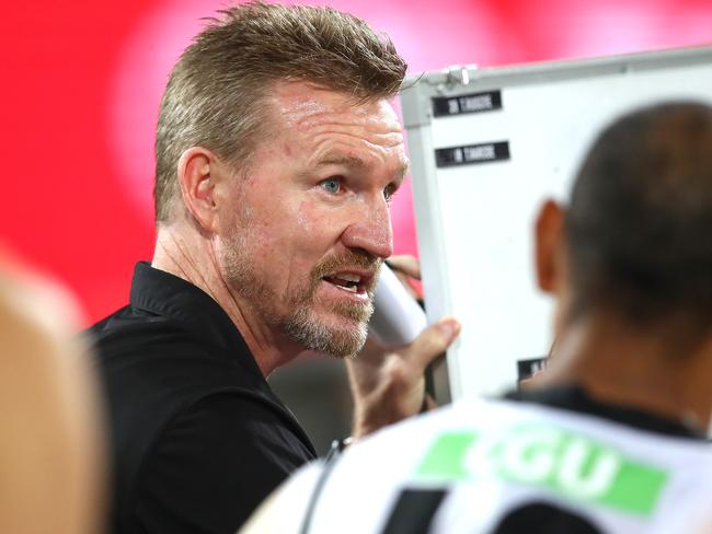 BRISBANE, AUSTRALIA - AUGUST 15: Magpies coach Nathan Buckley talks to his team during the round 12 AFL match between the Melbourne Demons and the Collingwood Magpies at The Gabba on August 15, 2020 in Brisbane, Australia. (Photo by Jono Searle/AFL Photos/via Getty Images)