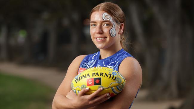 Mia King is proud to be part of AFLW indigenous round, pictured with a special Sherrin for the fortnight. Tidna Parntu means Australian Rules football in Kaurna Country. Picture: David Caird