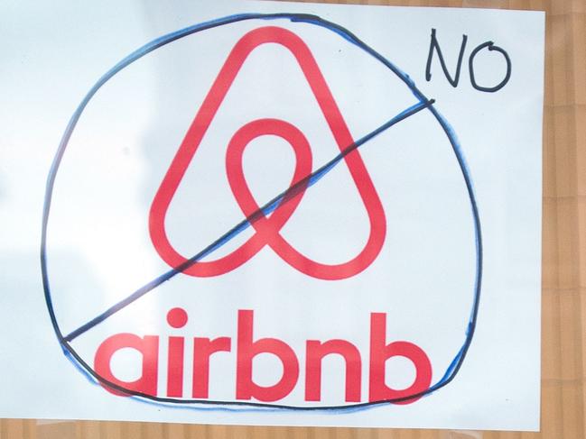 Signs showing support for Proposition F are posted on a shop window in San Francisco, California on November 2, 2015. Proposition F, known to some as the Airbnb initiative, restricts short term rentals in the city, which some say have contributed to skyrocketing rental rates. AFP PHOTO / JOSH EDELSON