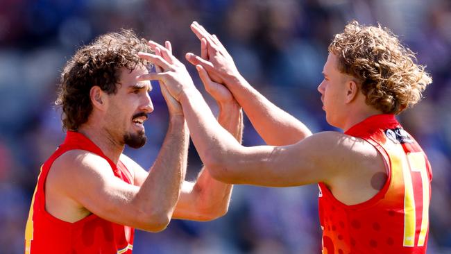 BALLARAT, AUSTRALIA - MARCH 24: Ben King of the Suns celebrates a goal with teammate Jed Walter during the 2024 AFL Round 02 match between the Western Bulldogs and the Gold Coast SUNS at Mars Stadium on March 24, 2024 in Ballarat, Australia. (Photo by Dylan Burns/AFL Photos via Getty Images)