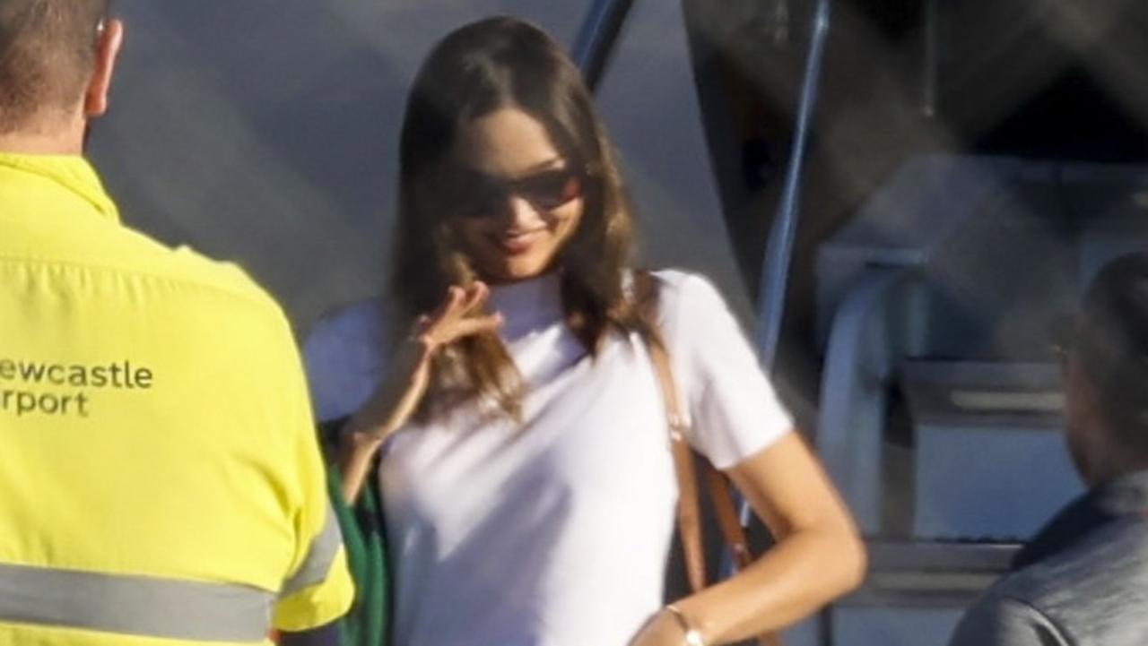 Miranda Kerr, billionaire husband jet into Newcastle Airport