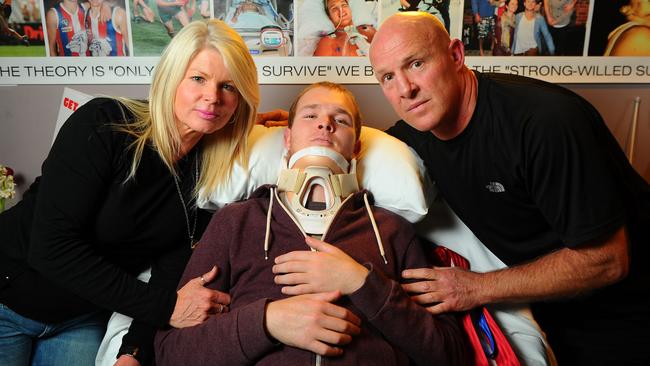 Fighting on: Beau, pictured with his parents Daryl and Kerrie, in hospital after his accident.