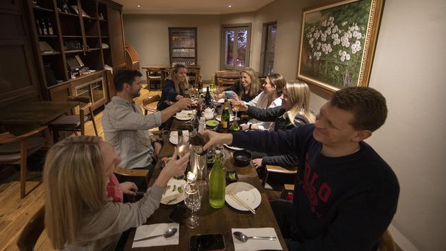 A group of friends dine at Yama Gardens in Darlinghurst on May 15. Photo: Ryan Pierse/Getty Images