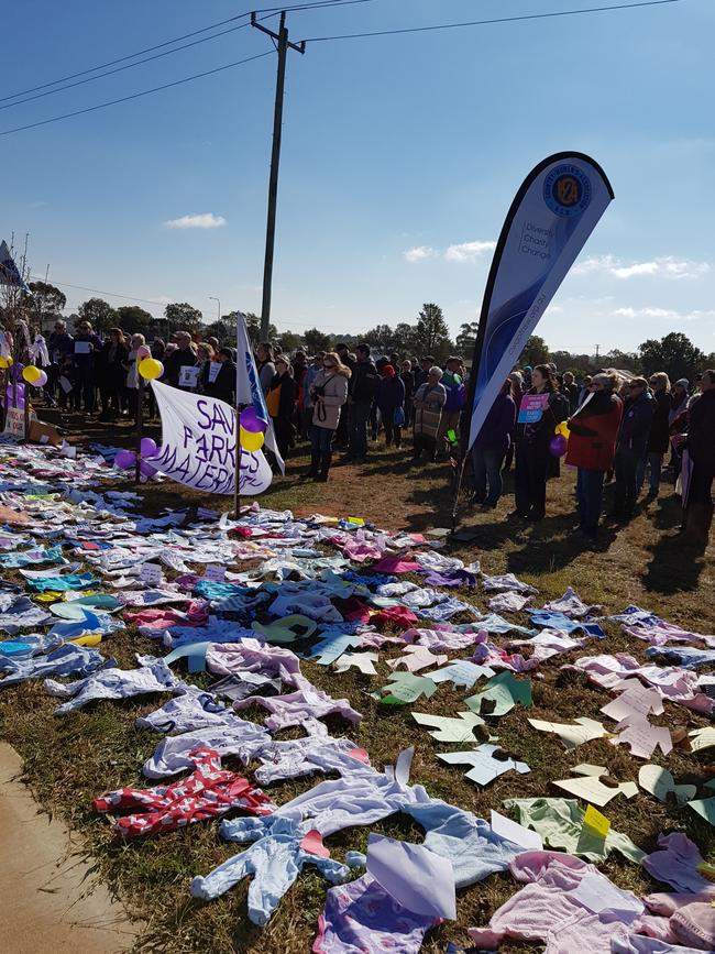 Locals held a rally, putting out baby jumpsuits to represent how many have been born in Parkes Hospital. Picture: Supplied