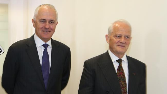 Into the fray ... Malcolm Turnbull and Philip Ruddock walk past the media after the vote on the leadership spill.