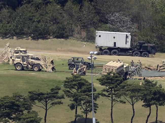 US Army soldiers install their missile defense system called Terminal High-Altitude Area Defense, or THAAD, at a golf course in Seongju, South Korea. Picture: AP