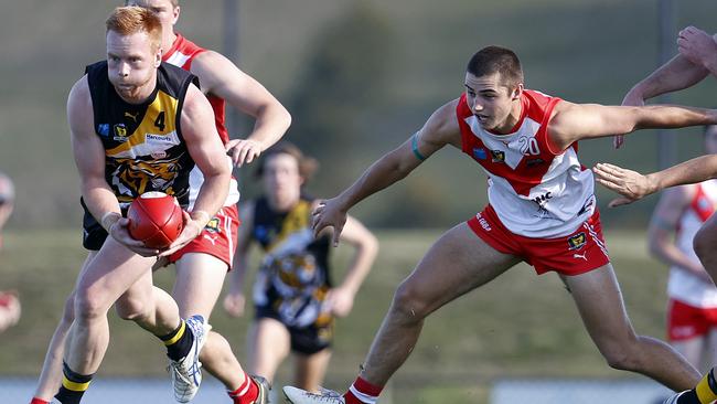 Tigers William Campbell bursts away from Clarence's Oliver Davis earlier in the season. Picture: Zak Simmonds