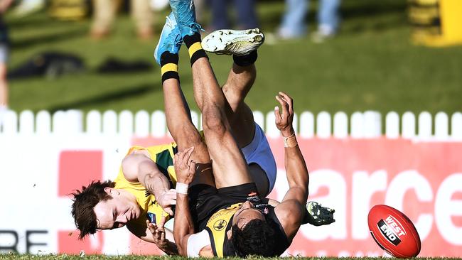 Eagle Rhyan Mansell applies his goal-saving tackle to Glenelg’s Marlon Motlop in his side’s convincing win at the Bay. Picture: MARK BRAKE.