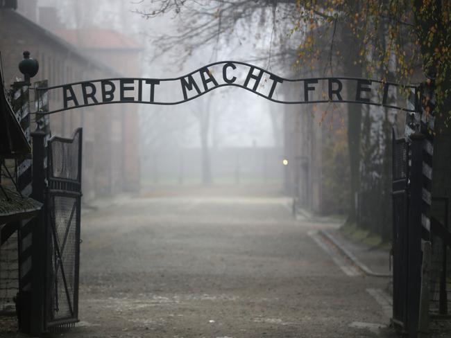 The infamous German inscription that reads ‘Work Makes Free’ at the main gate of the former Auschwitz I extermination camp on November 15, 2014 in Oswiecim, Poland. Picture: Christopher Furlong