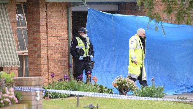 Police at the family home where Ms Harris’s body was found. Picture: Lawrence Pinder