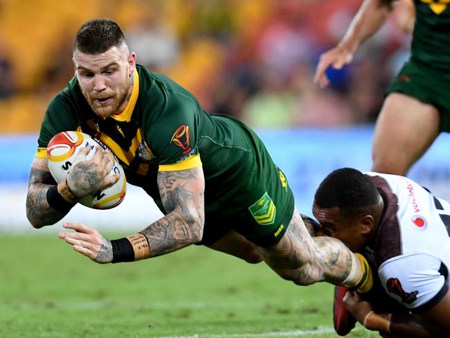 Josh Dugan tackled during the semi-final between Australia and Fiji.