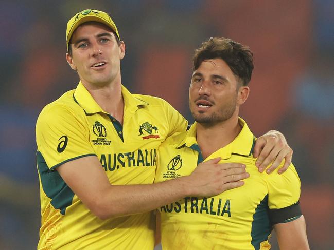 AHMEDABAD, INDIA - NOVEMBER 04: Marcus Stoinis and Pat Cummins of Australia celebrates the wicket of Chris Woakes of England during the ICC Men's Cricket World Cup India 2023 between England and Australia at Narendra Modi Stadium on November 04, 2023 in Ahmedabad, India. (Photo by Robert Cianflone/Getty Images)