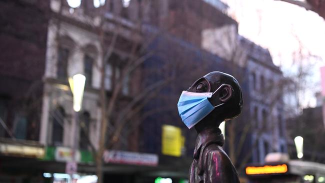 A statue wearing a face mask is seen in Melbourne. Picture: Getty Images