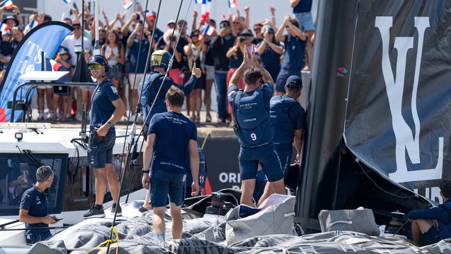 Members of the French Orient Express Racing Team acknowledge the warm welcome at the dock.