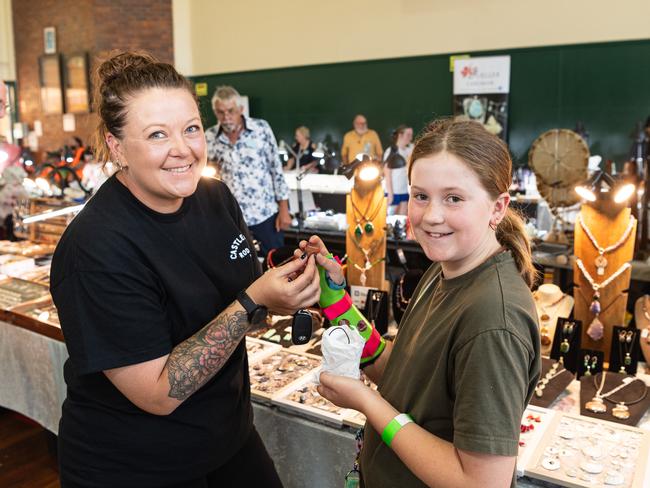 Sharmaine (left) and Charli McQueen check out the gems and jewellery from a lucky dip at Gemfest hosted by Toowoomba Lapidary Club at Centenary Heights State High School, Saturday, October 19, 2024. Picture: Kevin Farmer