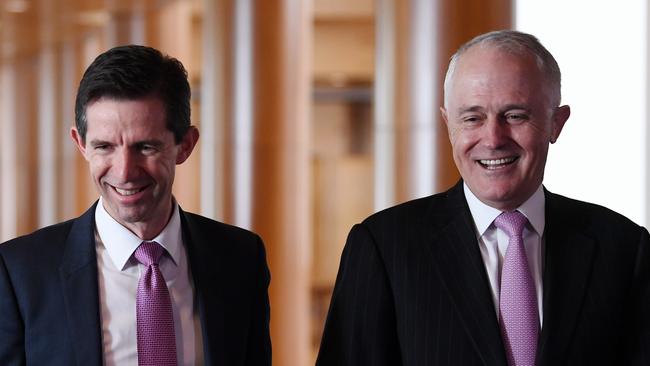 Australian Minister for Education and Training Simon Birmingham (left) and Australian Prime Minister Malcolm Turnbull speak to kids from Drummoyne Public School at Parliament House in Canberra. (Pic: Lukas Coch/AAP)