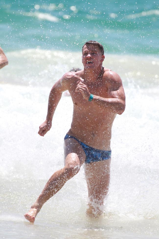 Rhys King running out of the water during the Southport Sharks VFL team’s preseason training camp at Tallebudgera Beach. Picture: Mike Batterham
