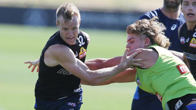 Will Hayes battles with first-round draft pick Bailey Smith at Western Bulldogs training. Picture: Michael Klein. 