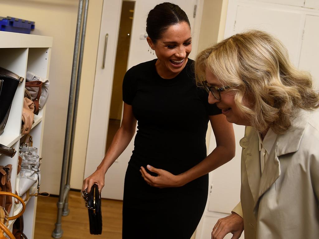 The Duchess looks at bags with Chair of Smart Works Lady Juliet Hughes-Hallett. Picture: Clodagh Kilcoyne/Pool via AP 