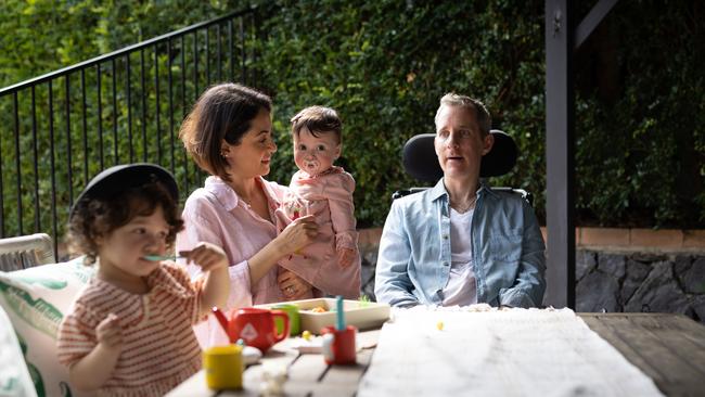 Johnny McCowen at home with wife Sherie and daughters Darcy and Riley. Picture: David Kelly.