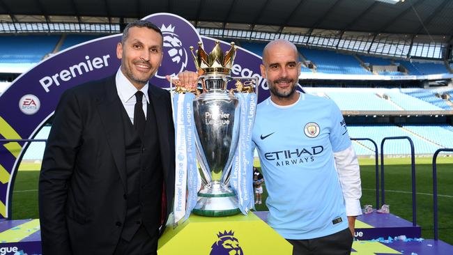 MANCHESTER, ENGLAND - MAY 06: Khaldoon al-Mubarak, Manchester City chairman and Josep Guardiola, Manager of Manchester City pose with the Premier League trophy as Manchester City win the Premier League after the Premier League match between Manchester City and Huddersfield Town at Etihad Stadium on May 6, 2018 in Manchester, England. (Photo by Michael Regan/Getty Images)